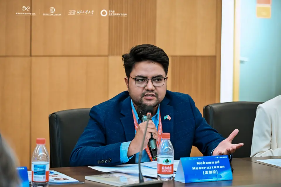 Md. Moneruzzaman presenting at a podium